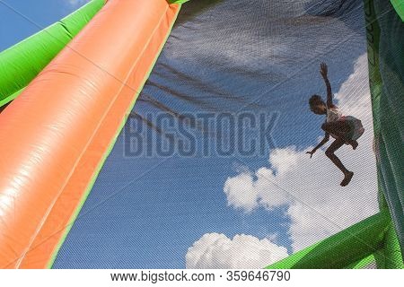 Atlanta, Ga/usa - August 10:  An Unidentified Girl Jumps Into A Soft Plastic Pit From A Two-story He