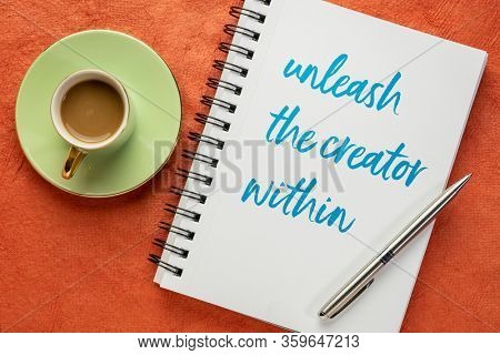 unleash the creator within - inspiratonal note, handwriting in a sketchbook with a cup of coffee, creativity and personal development concept