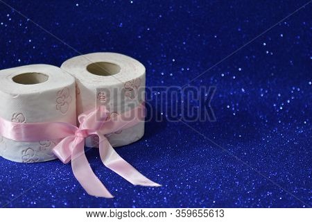 Rolls Of Toilet Paper On Glitter Blue Background