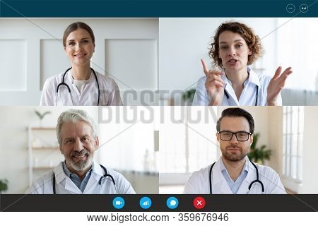 Doctors Engaged In Distant Communication By Videocall Computer Screen View
