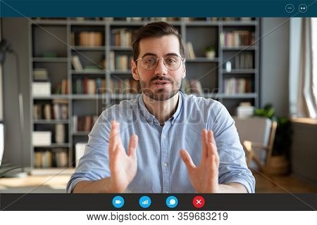 Businessman Participates At Negotiations By Videocall Via Teleconference, Screen View
