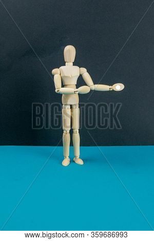 Wooden Mannequin On Black Table And Blue Background. Trun Right Concept. Close-up