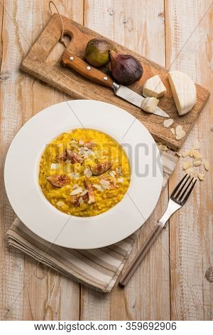milanese risotto with cheese fig and sliced almond