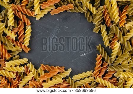 Fusili Pasta. Closeup Of Raw Fusilli Macaroni In Spiral Shape With Empty Middle For Messages. On A G