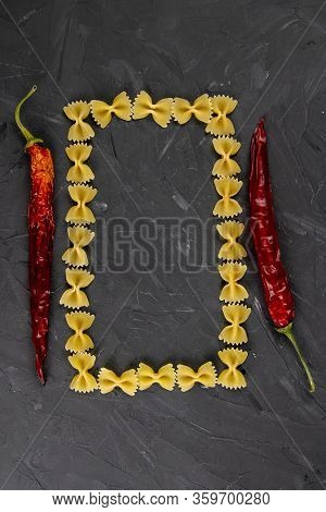 Farfalle Raw Farfallini Colored Italian Pasta On A Wood Black Background Banner. Top Views With Clea