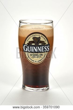 Montreal, Canada - March 15, 2020: An Originall Guinness Glass Of Dark Stout Beer. Guinness Is A Dar