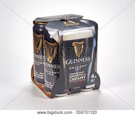 Montreal, Canada - March 15, 2020: A Pack Of Cans Of Dark Guinness Beer Over White Background. Guinn