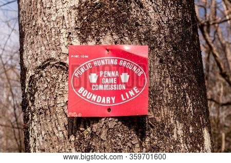 Deerfield Township, Pennsylvania Usa 4/5/20 A Red Metal Sign With White Writing Public Hunting Groun