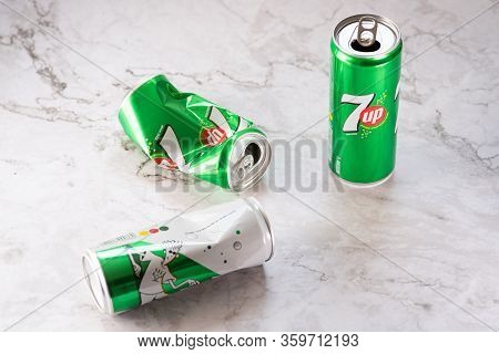 Nicosia, Cyprus -  March 01, 2020: Two Smashed Empty Aluminium 7up Tin Cans Ready For Recycling