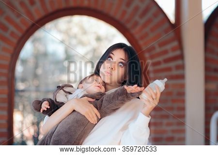 Hungry Impatient Baby Reaching For Feeding Bottle