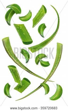 Healthy Skin Care Ingredients. Aloe Vera Slices And Leaves Flying Isolated On A White Background. Le