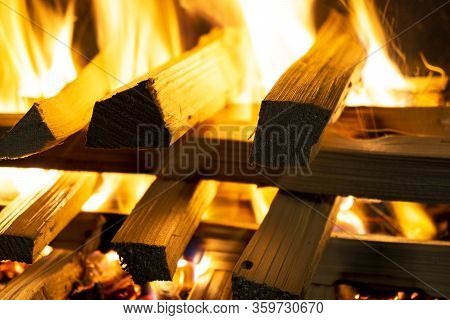 Burning Wood Logs In The Fireplace Close Up. Barbeque Fire. Charcoal And Burning Wood Background. Fi