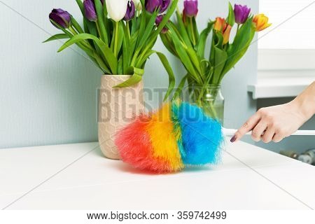Housewife Wipes Dust With A Dust Brush During Spring Cleaning At Home. Household Chores And Housekee