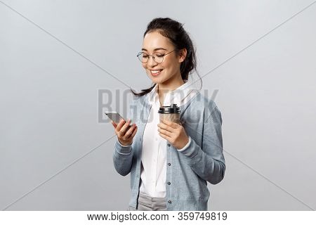 Office Lifestyle, Business And People Concept. Attractive Young Korean Woman Checking Her Phone Mess
