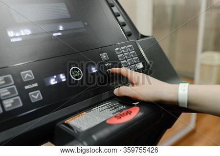 Get Ready To Run- Hand Pushes The Green Start Button On A Treadmill In A Home Gym, Hand Click Stop B