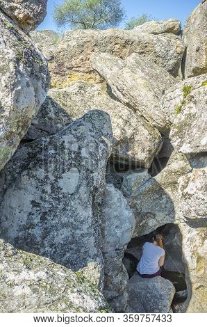 Young Trekker Woman Visiting Spectacular Granitic Rock Chanels And Pothholes Eroded By Flood Flows. 