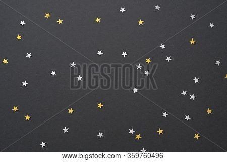 Festive Black Background With Silver And Gold Star Confetti