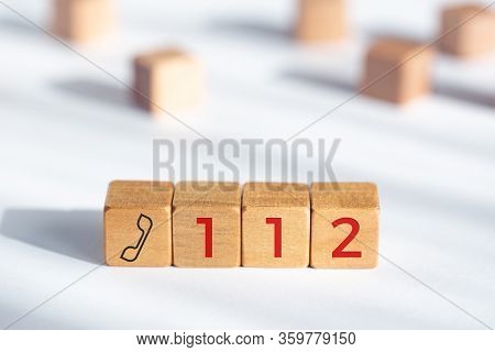 112 Emergency Concept. Wooden Dices With Phone Icon And 112 Text