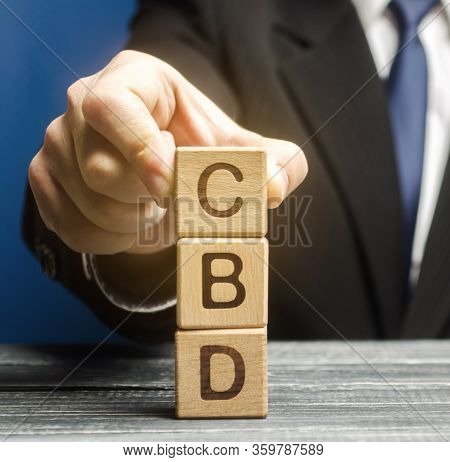 Wooden Blocks With The Word Cbd. Marijuana, Cannabis, Hemp. Concept Of Cannabidiol