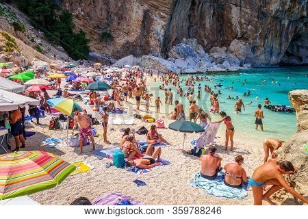 Sardinia/italy - August 26, 2019 - Crowd Of Tourists On Cala Mariolu Beach In The Golf Of Orosei