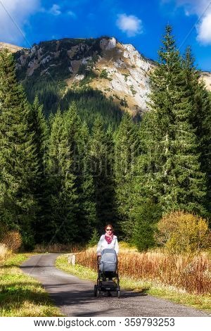 Woman With Pram Walking In Ticha Valley In High Tatras, Slovakia