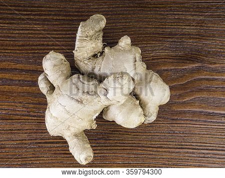Fresh Ginger Root On Wooden Table Background, Antivir. Naturally Elevating Your Energy Levels, Close