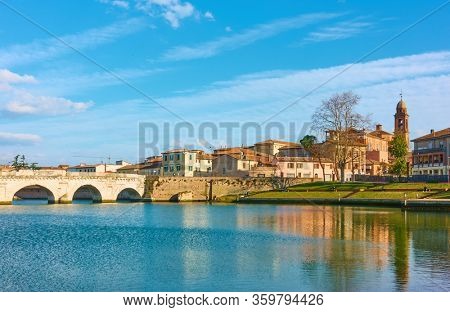 Panoramic view of old town of Rimini with the bridge of Tiberius (Ponte di Tiberio), Italy