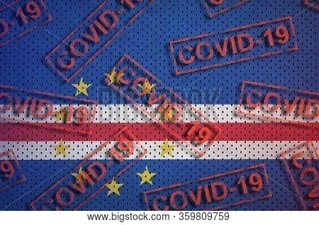 Cabo Verde Flag And Many Red Covid-19 Stamps. Coronavirus Or 2019-ncov Virus Concept