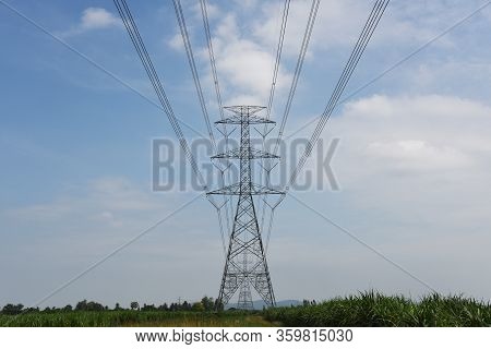 High Voltage Power Line Tower With Blue Sky Background