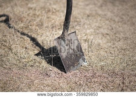 A Shovel Stuck In The Ground. Close Up.