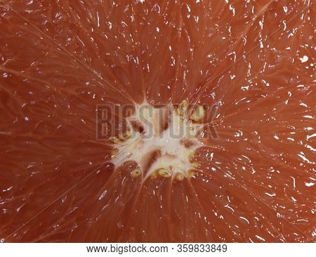 Texture Of Grapefruit Slice, Close-up, Citrus Backgrounds. Macro Of Red Grapefruit. Fresh Grapefruit