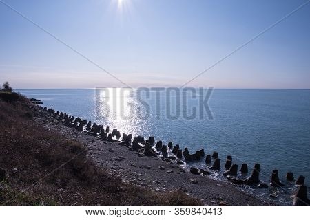 Tetrapod Breakwaters On The Coast. Concrete Breakwaters Of Tetrapods Lie All Along The Coast.