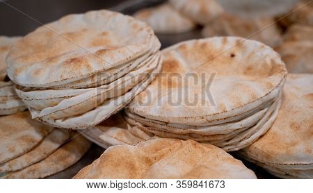 Kuboos Or Khubz - Fresh Pita Bread Togeather In A Table Table