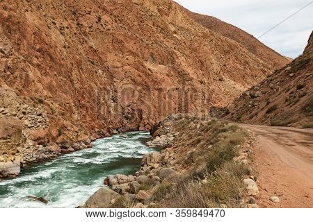 Mountain Road Along The Kokemeren River In Naryn Region Of Kyrgyzstan