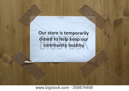 A Sign Attached To The Door With The Words 