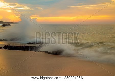 Seascape. Sunset Time At The Beach. Ocean With Strong Waves. Horizon Line. Beach With Rocks, Stones,