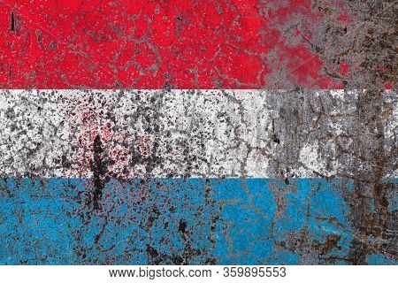 National Flag Of Luxembourg On Old Peeling Wall Background.the Concept Of National Pride And Symbol 