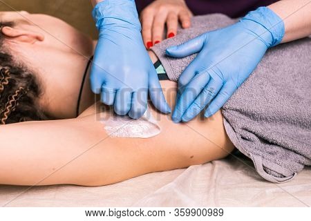 Waxing Woman Armpit. Salon Wax Beautician Epilation Procedure. Waxing Female Body For Hair Removal B