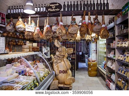 Italy, Bari, August, 2017 - Italian Grocery Store With Hamon Or Jamon, Mixed Cheeses And Wine In Bar