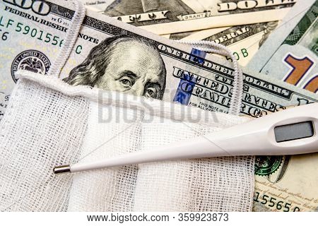 A Hundred-dollar Bill With A Medical Mask .the Concept Of Coronavrius Epidemic