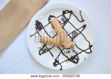Wafer Roll With Condened Milk. Coffee Desserts. Delicious Dessert With Coffee.