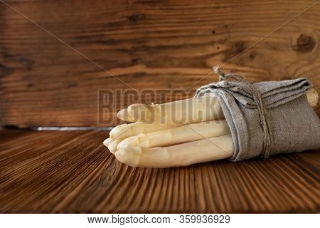 Bunch White Asparagus On Rustic Wooden Background. Close Up Photography With Space For Text. Concept