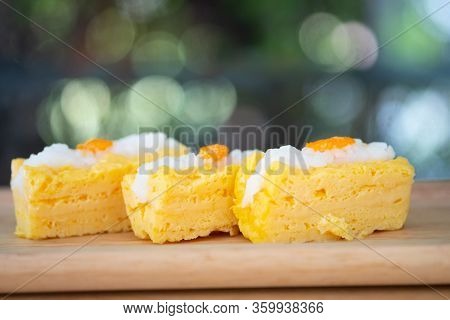 Close Up Of Grilled Tamago Sushi With Rice And Ebiko