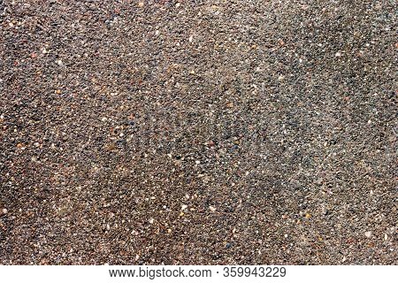 Abstract Brown Grey Asphalt Pavement Rough Road Surface Background. Roadway Highway Seamless Texture