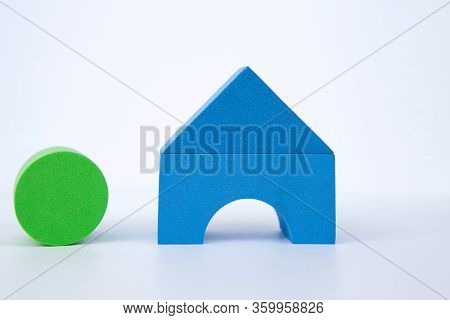 Toy House On A White Background. A House Made Of Color Bricks. With Space For Writing
