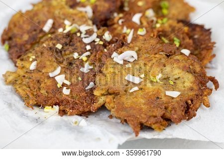 Fried Grated Potatoes Pancakes Served On The Plate