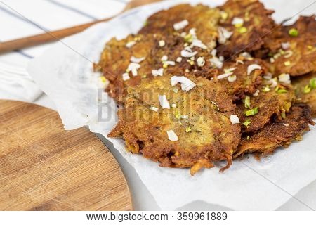 Fried Grated Potatoes Pancakes Served On The Plate