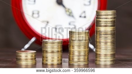 Coronavirus Financial Stimulus, Aid Package Symbol, Help Concept. Gold Money Coins And Alarm Clock I