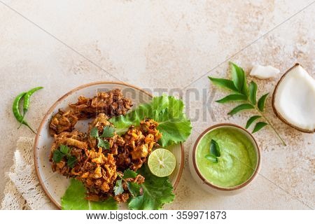 Indian Cuisine Indian Food. Pakora Traditional Indian Deep-fried Snack. Pakoras On Black Plate With 