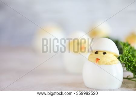 Deviled Eggs For Easter Decorated As Cute Little Chicks Hatching From Eggs With Carrot Beak And Seaw